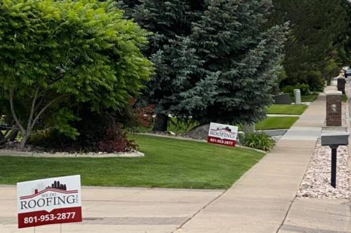 Sidewalk sign for real estate agent with contact info for We Do Roofing Salt Lake City